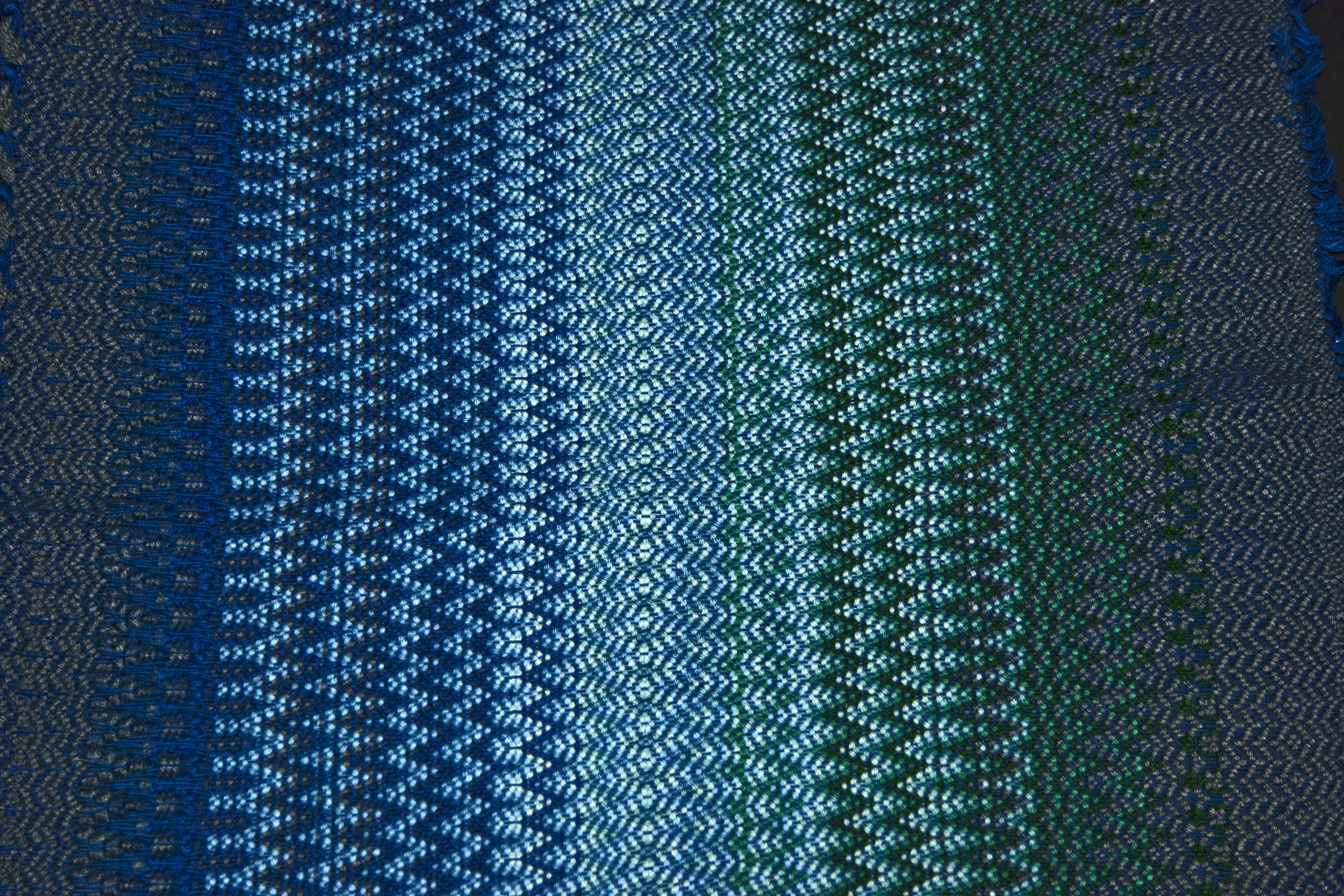 Norwegian Krokbragd using acrylic yarn in shades of blue.