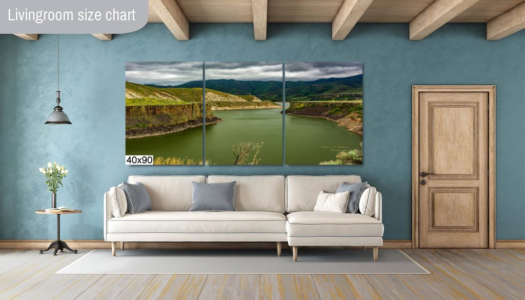 More's Creek as a 40 x 90 inch 3-panel display above a white couch