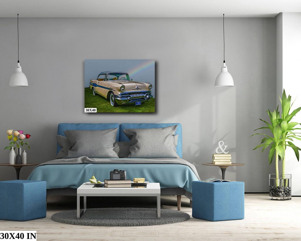 The 1957 Pontiac Star Chief as a 30x40 stretched canvas print hanging above a king-sized bed